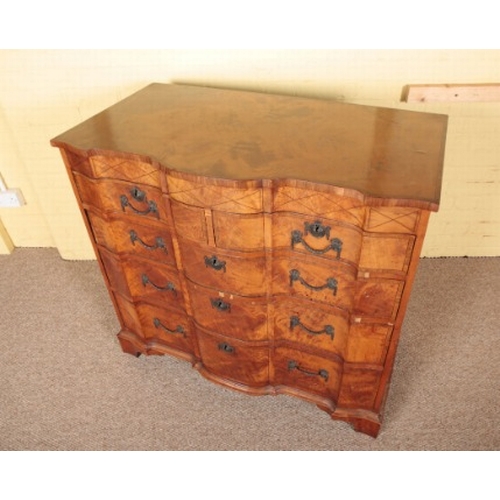 454 - A CONTINENTAL WALNUT CHEST OF DRAWERS

late 18th century, the crossbanded, boxwood and ebony stung t... 