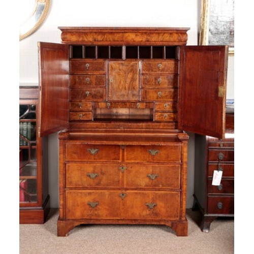 488 - A QUEEN ANNE WALNUT CABINET ON STAND

the upper section with a moulded cornice over a cushion front ... 