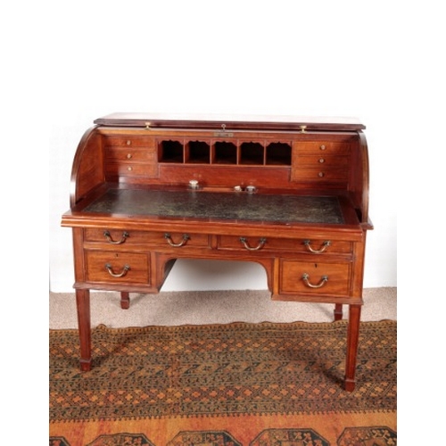 499 - A LATE VICTORIAN MAHOGANY AND EBONY STRUNG CYLINDER DESK

the tambour front lifting to reveal a slid... 