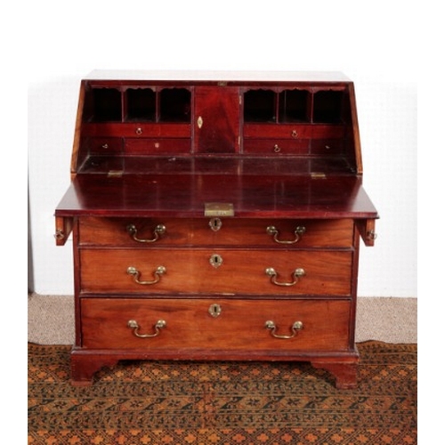 502 - A GEORGE III MAHOGANY BUREAU

the fall front opening to an interior fitted with small drawers and pi... 