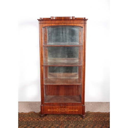 521 - A FRENCH ROSEWOOD AND MARQUETRY VITRINE

late 19th century, the glazed doors opening to shelves, a s... 