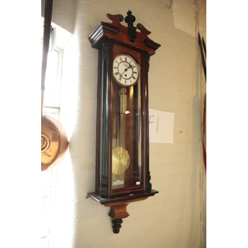 523 - A VIENNA WALNUT CASED WALL CLOCK

19th century, with white enamel dial, black Roman numerals and dar... 