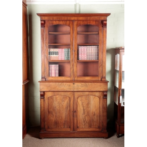 524 - A VICTORIAN MAHOGANY BOOKCASE

the upper section with glazed doors opening to shelves and flanked by... 