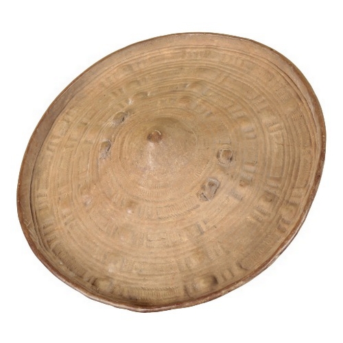 525 - AN AFRICAN HIDE

19th century, with embossed decoration and hide grip, 33cm diameter