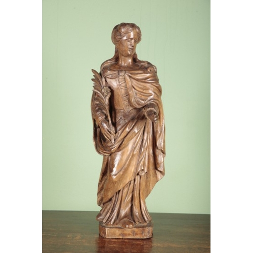 526 - A CARVED LIMEWOOD FIGURE OF ST CATHERINE OF ALEXANDRIA

possibly German, 17th century, carved with f... 