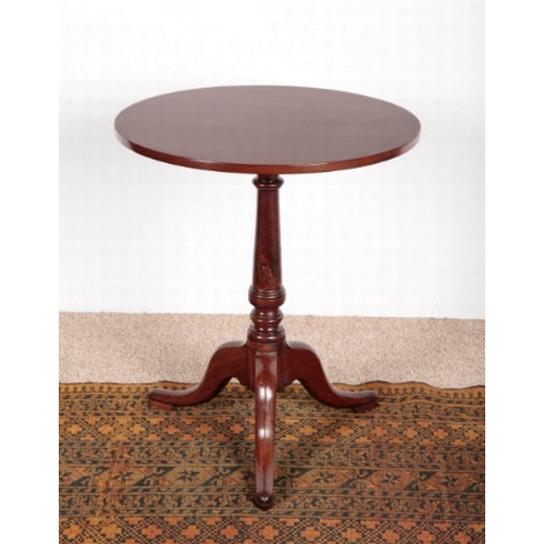 537 - A LATE GEORGE III MAHOGANY TRIPOD TABLE

the circular tilt-top on a turned stem and cabriole legs, 6... 