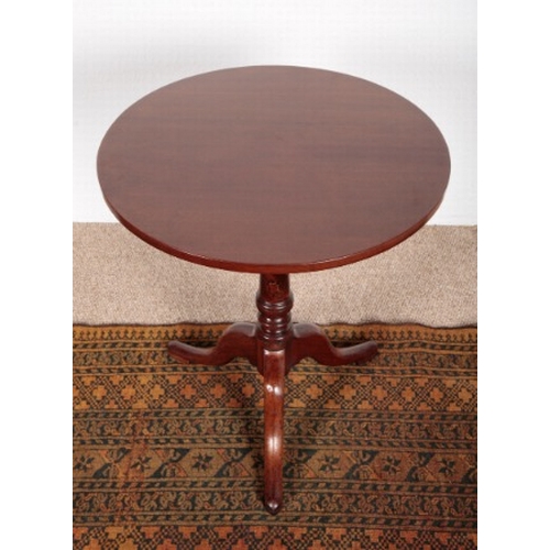 537 - A LATE GEORGE III MAHOGANY TRIPOD TABLE

the circular tilt-top on a turned stem and cabriole legs, 6... 