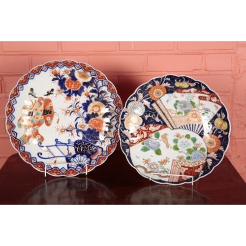 54 - A GROUP OF THREE JAPANESE IMARI CHARGERS

Meiji period, including one decorated with figures, 40cm d... 