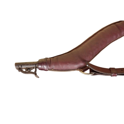 547 - A LEATHER SHOULDER SHOT FLASK

circa 1880, 75cm long