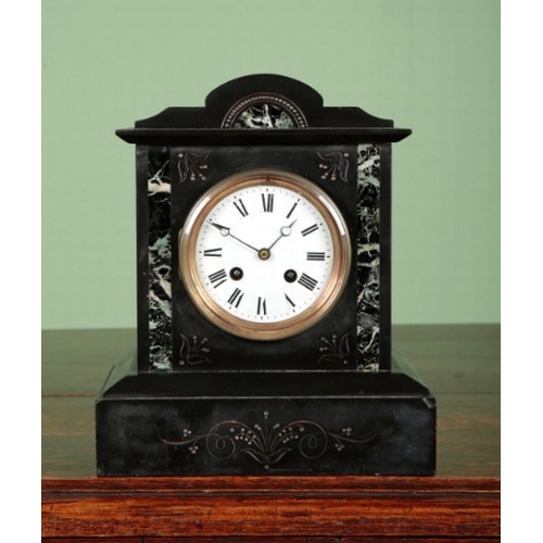 550 - A VICTORIAN SLATE AND VERDE ANTICO MANTEL CLOCK

the eight day movement with an open escarpment enam... 