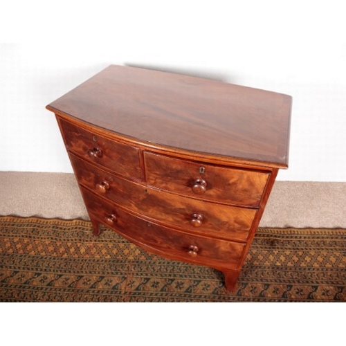 554 - A REGENCY MAHOGANY BOWFRONT CHEST OF DRAWERS

with two short and two long drawers over a shaped apro... 