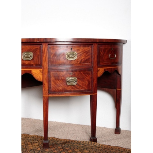 564 - A GEORGE III MAHOGANY SIDEBOARD IN SHERATON STYLE

circa 1780, the crossbanded top over an arrangeme... 