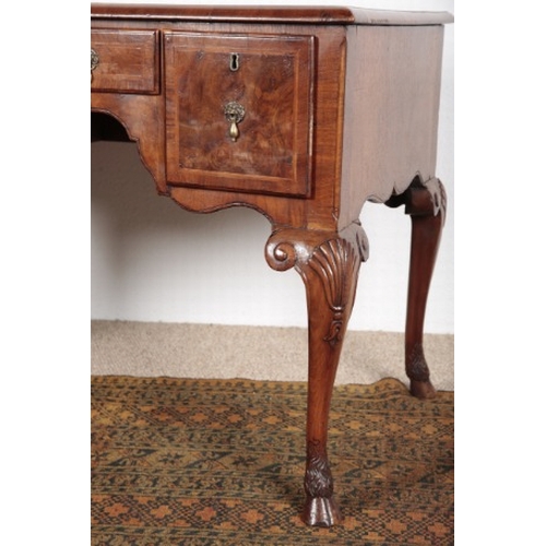 585 - A QUEEN ANNE STYLE WALNUT LOW BOY

19th century, the herringbone crossbanded top over three short dr... 