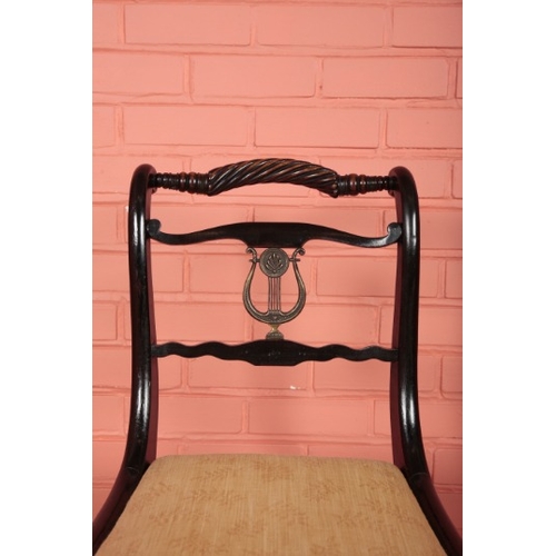 61 - A SET OF SIX REGENCY EBONISED DINING CHAIRS

the rope-twist top rails over a gilt metal mounted lyre... 