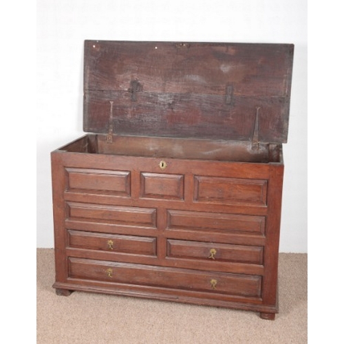 637 - AN OAK MULE CHEST

early 18th century, with geometric panelled front, the top chest with two short d... 