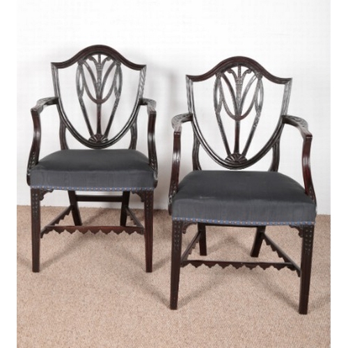 639 - A PAIR OF GEORGIAN MAHOGANY ARMCHAIRS

with shield backs, upholstered seats, on tapering legs, 93cm ... 