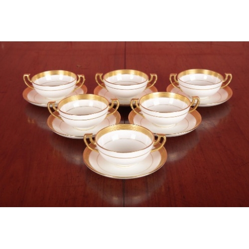 64 - A SET OF SIX MINTON TWO-HANDLED CUPS AND SAUCERS

marked to the base, with gilded rims, the saucers ... 