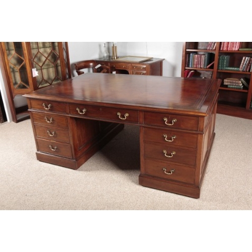 646 - A MAHOGANY PARTNERS DESK

late 19th century, with a brown leather tooled top above nine single drawe... 