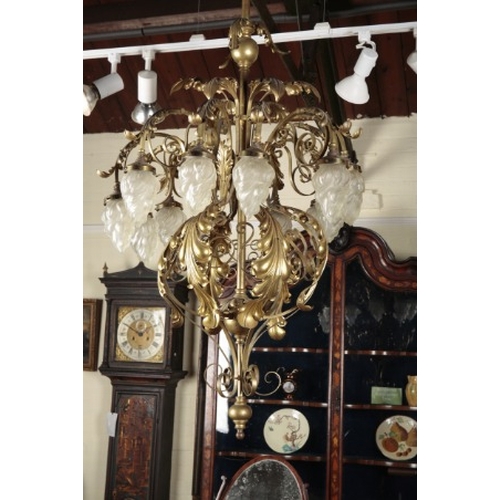 649 - A VICTORIAN GILT METAL TEN BRANCH CHANDELIER

with gilt metal floral decoration and glass flames, 17... 