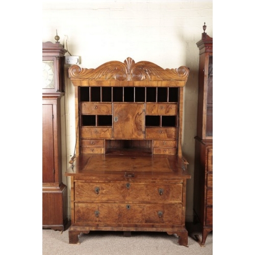 650 - A BURR AND FIGURED WALNUT ESCRITOIRE

circa 1720, with fitted interior of drawers and pigeonholes, t... 