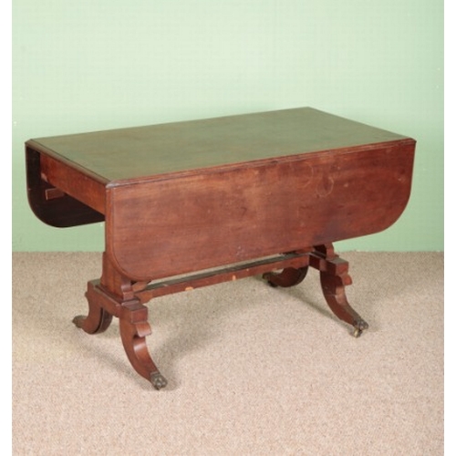 652 - A VICTORIAN MAHOGANY DROP-LEAF SIDE TABLE

with a single drawer, on twin fluted legs to brass castor... 