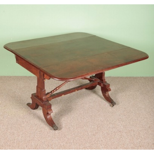 652 - A VICTORIAN MAHOGANY DROP-LEAF SIDE TABLE

with a single drawer, on twin fluted legs to brass castor... 