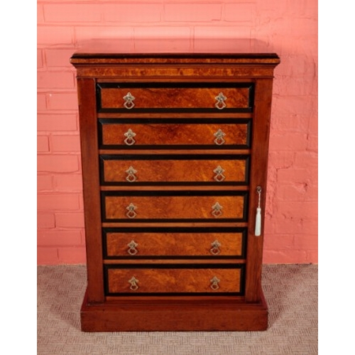 66 - A VICTORIAN AMBOYNA AND EBONY BANDED WELLINGTON CHEST

with six graduated drawers on a pedestal base... 