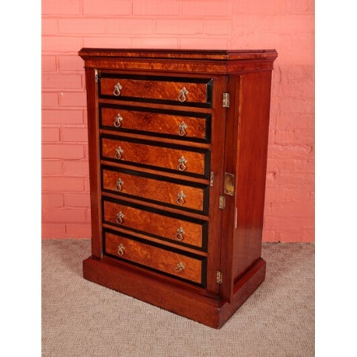 66 - A VICTORIAN AMBOYNA AND EBONY BANDED WELLINGTON CHEST

with six graduated drawers on a pedestal base... 