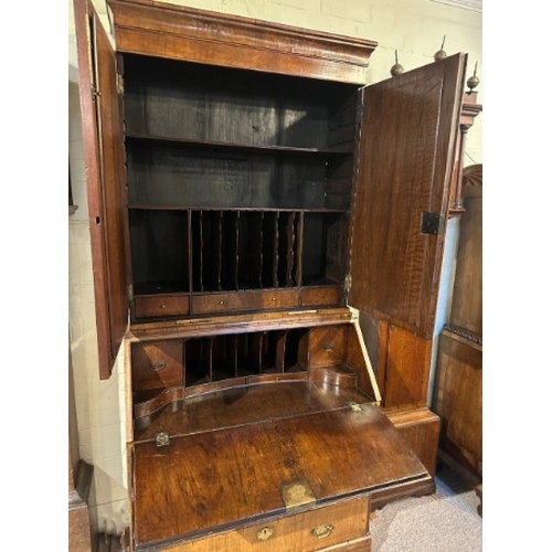 665 - A BUREAU BOOKCASE

18th century, with mirrored top section above the bureau base of two short and tw... 