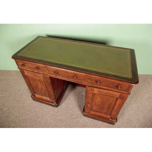 667 - A VICTORIAN MAHOGANY PEDESTAL DESK

with tooled green leather top and three single drawers, 76cm hig... 