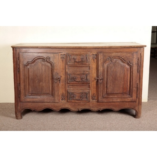 690 - A FRENCH PROVINCIAL OAK DRESSER OR ENFILADE

19th century, the central row of three drawers flanked ... 