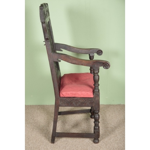 696 - AN OAK WAINSCOT CHAIR

mid-17th century, a scrolled top rail with central panel elaborately carved w... 