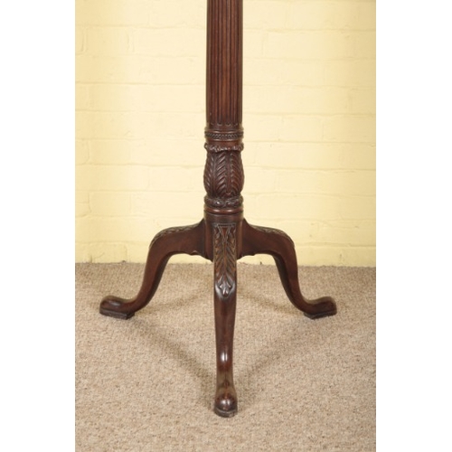 71 - A VICTORIAN MAHOGANY TORCHERE

the circular top on a stop fluted columnar stem, on a tripod base wit... 