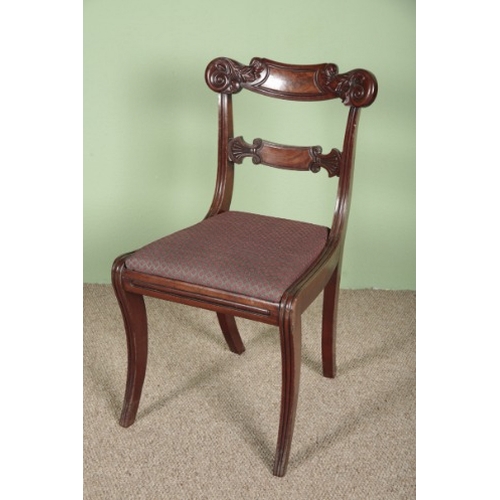 728 - A SET OF FOUR WILLIAM IV MAHOGANY DINING CHAIRS

with carved tablet backs and upholstered drop-in se... 