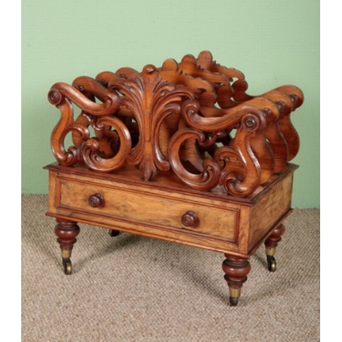 737 - A VICTORIAN WALNUT CANTERBURY

with single drawer, on turned legs to brass castors, 52cm x 50cm