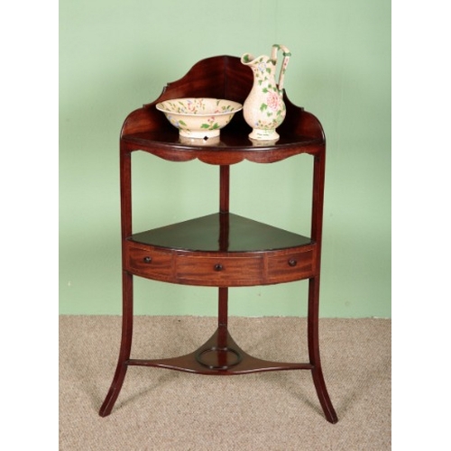 748 - A MAHOGANY CORNER WASHSTAND

19th century, with three single drawers, with a bowl and a water jug, 1... 