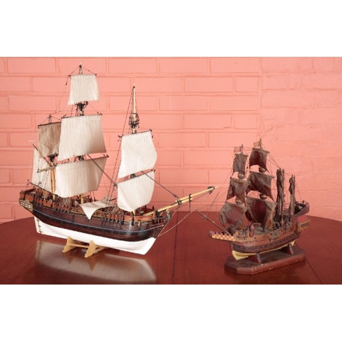 76 - A SCRATCH BUILT MODEL OF A GALLEON

fully rigged and painted in polychrome, 63cm high overall; toget... 