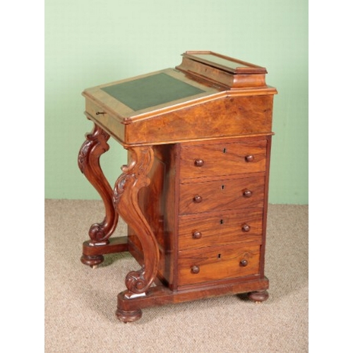 767 - A VICTORIAN WALNUT DAVENPORT

the leather inset writing slope opening to an interior fitted with dra... 