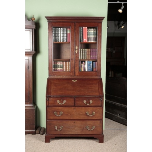 768 - A GEORGE III MAHOGANY BUREAU BOOKCASE

the upper section with a moulded cornice over glazed doors, t... 