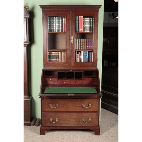 768 - A GEORGE III MAHOGANY BUREAU BOOKCASE

the upper section with a moulded cornice over glazed doors, t... 