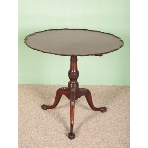 770 - A GEORGE III STYLE MAHOGANY TRIPOD TABLE

the tilt-top with pie-crust edge on a ring turned baluster... 