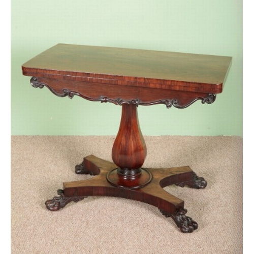 785 - A WILLIAM IV ROSEWOOD CARD TABLE

the hinged top opening to a green baize lined surface, on a facete... 