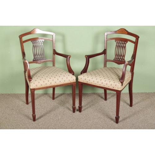 787 - A SET OF EIGHT EDWARDIAN MAHOGANY AND MARQUETRY DINING CHAIRS

the shaped cresting rails inlaid with... 