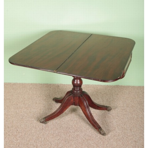 788 - A MAHOGANY TEA TABLE

early 19th century, the hinged top over a moulded frieze, on a turned stem to ... 