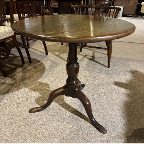 800 - A GEORGE III OAK TRIPOD TABLE

with baluster stem terminating on flattened pad feet, 66cm high x 68c... 