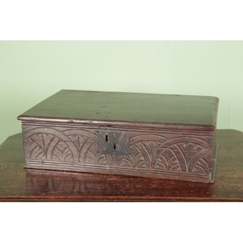 804 - A CARVED OAK BIBLE BOX

17th century, the front decorated with foliate details contained within inte... 