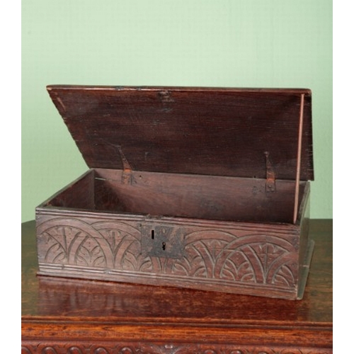 804 - A CARVED OAK BIBLE BOX

17th century, the front decorated with foliate details contained within inte... 