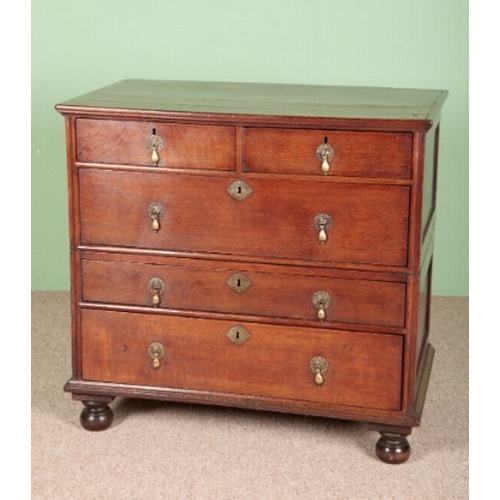 812 - AN OAK CHEST OF DRAWERS

early 18th century, in two parts, with two short and three long drawers on ... 