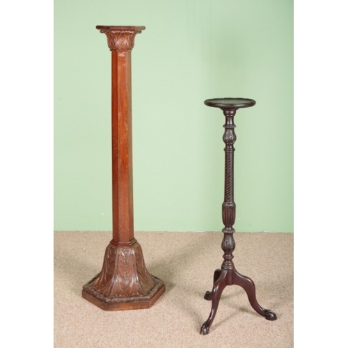 813 - A WALNUT TORCHERE

circa 1900, the hexagonal top on a columnar stem and heavily carved acanthus leaf... 