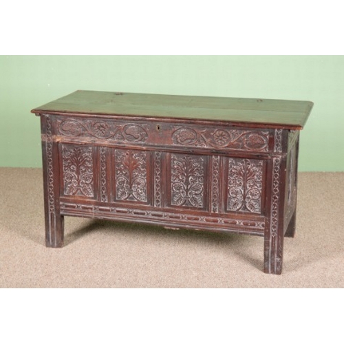 832 - A CHARLES II OAK COFFER

the hinged top opening to an interior fitted with a later 'candle box', the... 